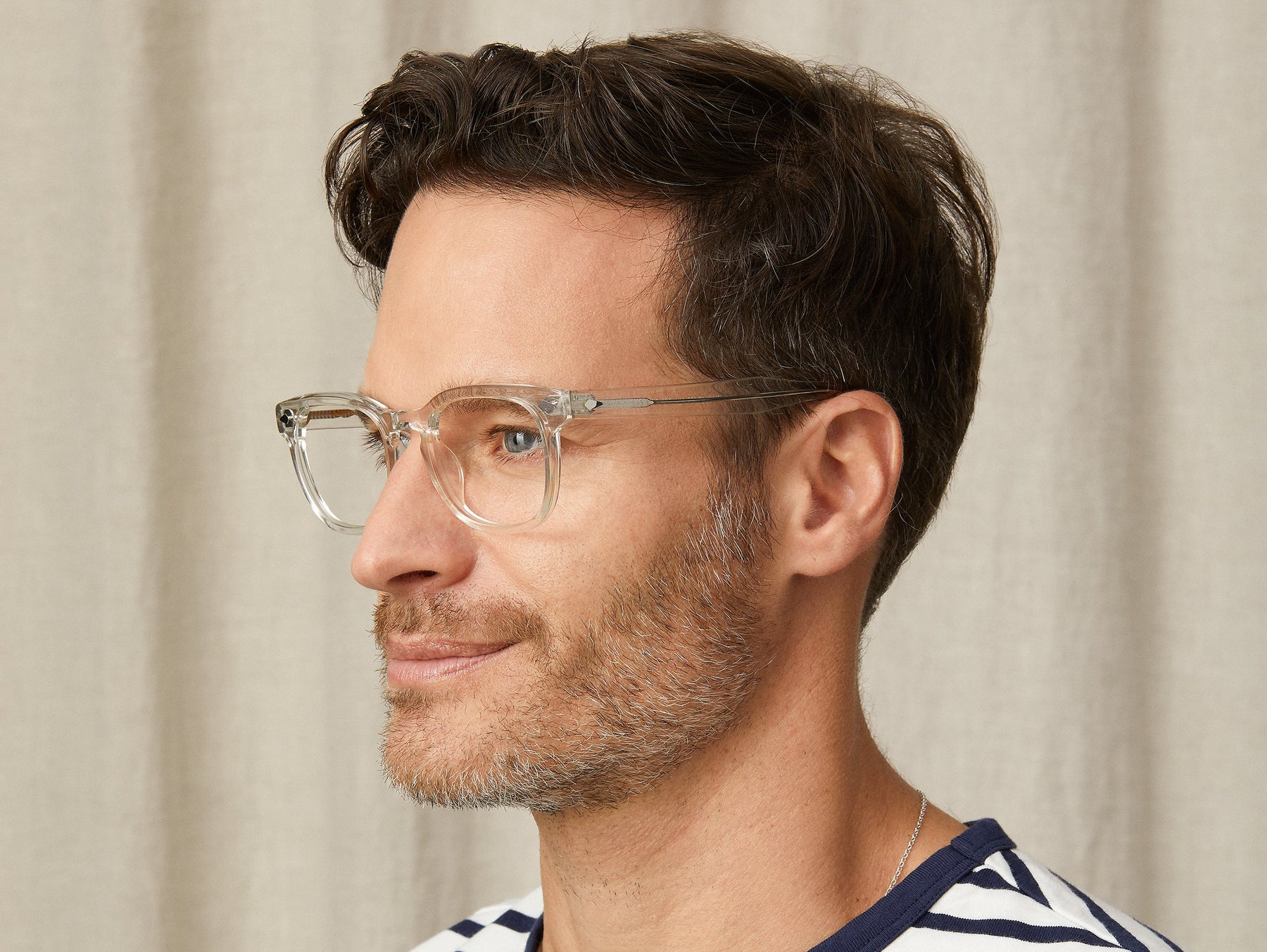 Model is wearing The GELT in Crystal in size 46 with Blue Protect Lenses