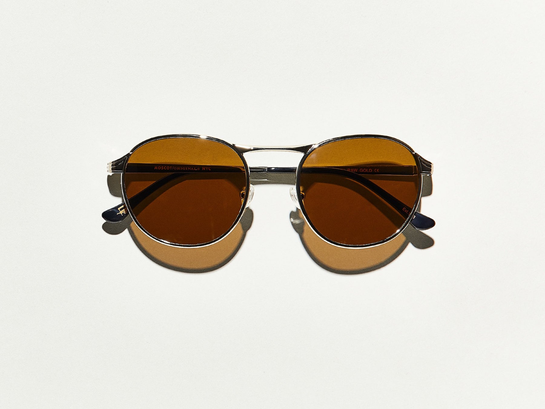 The GROYSE SUN in Raw Gold with Cosmitan Brown Glass Lenses