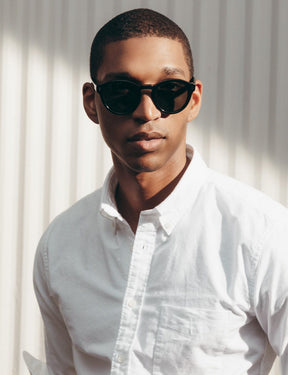 Model is wearing The KEPPE SUN in Black in size 48 with G-15 Glass Lenses