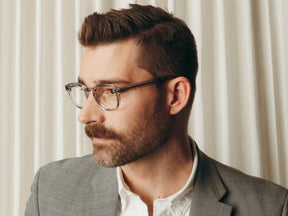 Model is wearing The LEMTOSH with Blue Light Filter in size 49 in Light Grey