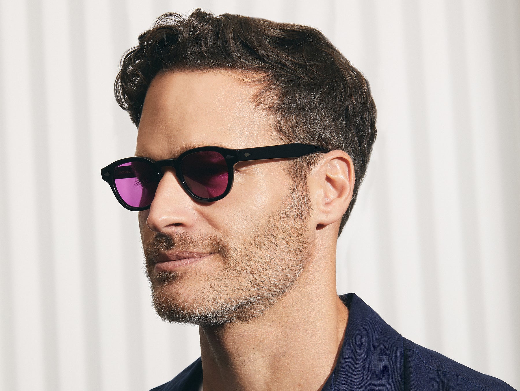 Model is wearing The LEMTOSH in Black size 46 with Purple Nurple Tinted Lenses