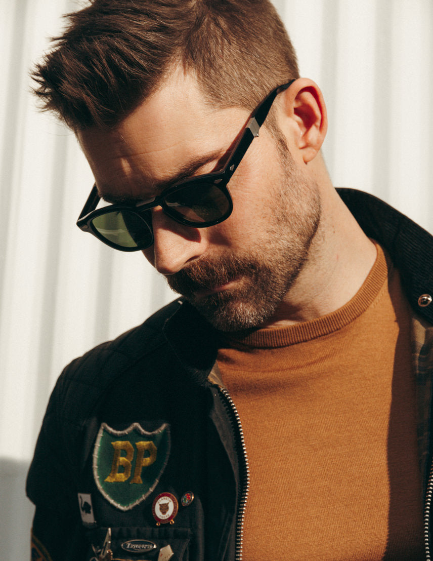 Model is wearing The LEMTOSH FOLD in Black in size 46 with G-15 Glass Lenses