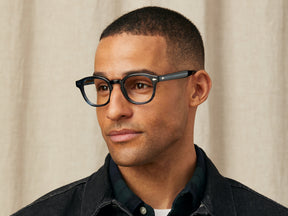 Model is wearing The LEMTOSH in size 49 in Ink