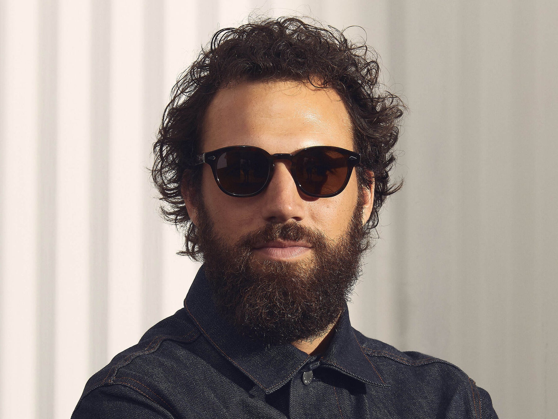 Model is wearing The LEMTOSH SUN-POLARIZED in size 46 in Tortoise with Cosmitan Brown Polarized Glass Lenses