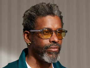 Model is wearing The LEMTOSH in Light Grey in size 49 with Pastel Yellow Tinted Lenses