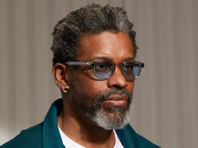 Model is wearing The LEMTOSH in Light Grey in size 49 with Bel Air Blue Tinted Lenses