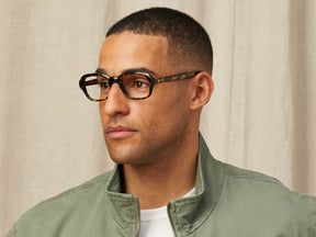 Model is wearing The MESHUG in size 51 in Tortoise