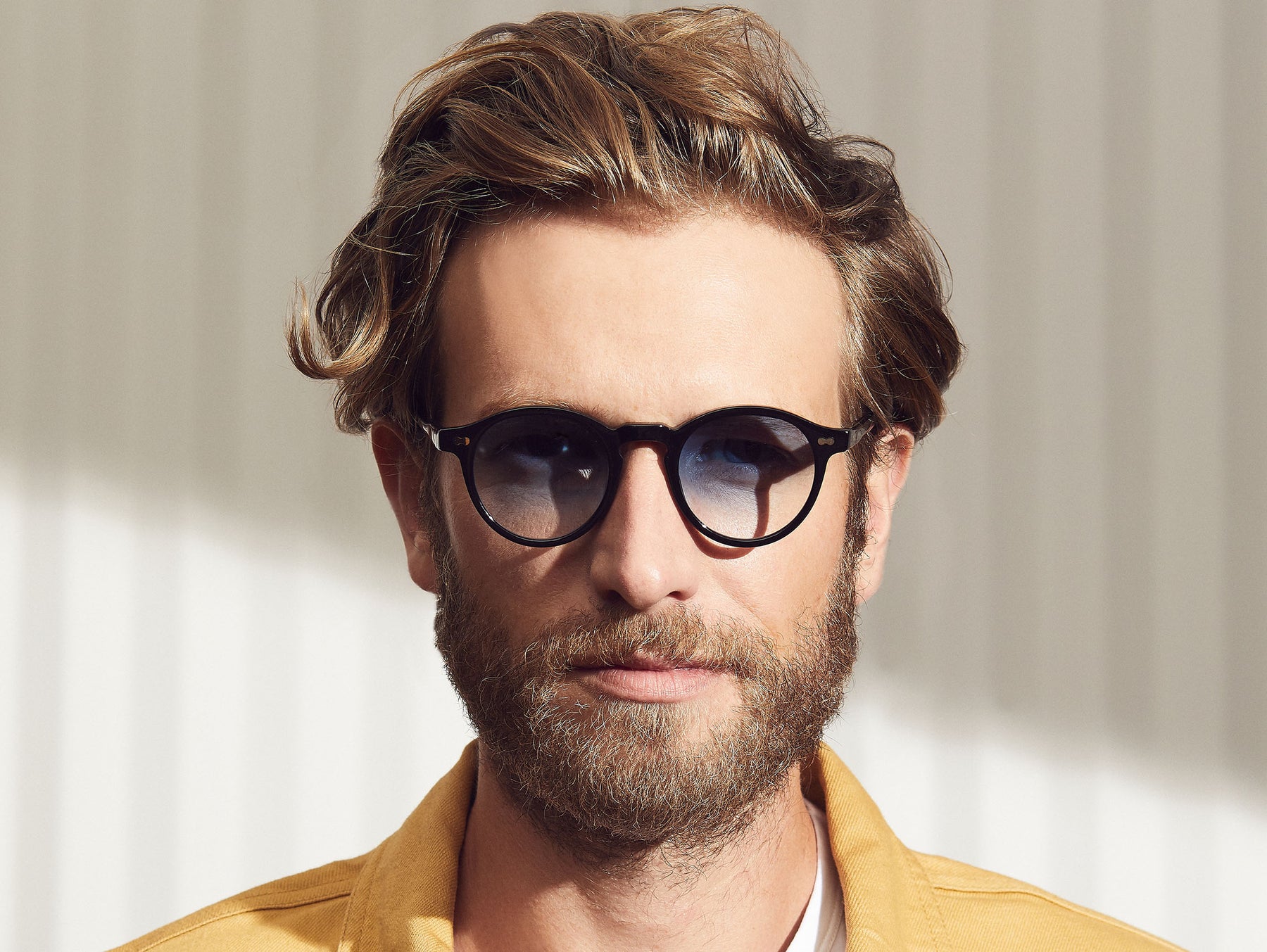 Model is wearing The MILTZEN in Black in size 46 with Broadway Blue Fade Tinted Lenses