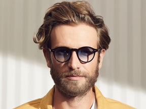 Model is wearing The MILTZEN in Black in size 46 with Broadway Blue Fade Tinted Lenses