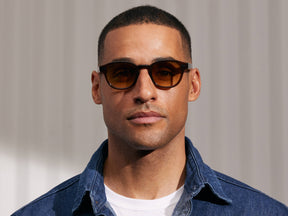 Model is wearing The LEMTOSH in Brown in size 46 with Chestnut Fade Tinted Lenses