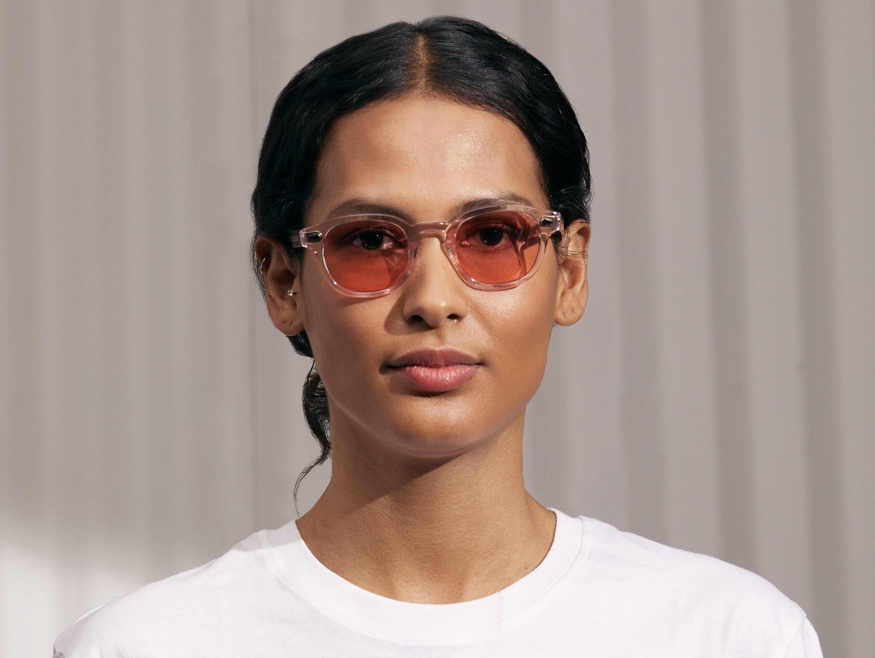 Model is wearing The LEMTOSH in Blush in size 46 with New York Rose Tinted Lenses