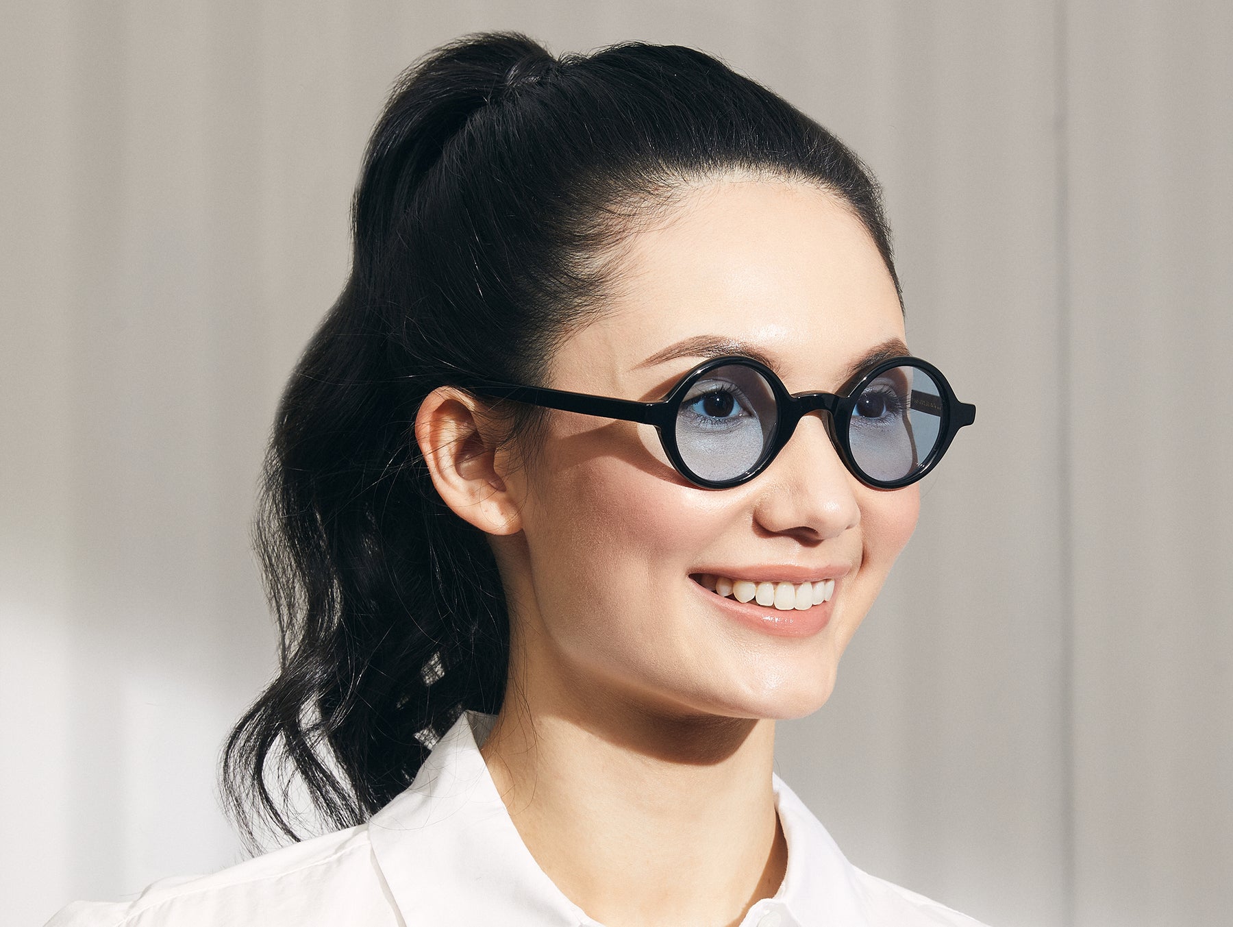 Model is wearing The ZOLMAN in Black in size 42 with Bel Air Blue Tinted Lenses