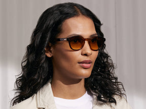 Model is wearing The LEMTOSH in Tobacco in size 46 with Chestnut Fade Tinted Lenses