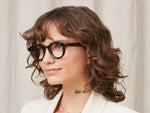 Model is wearing The DAHVEN in size 44 in Tortoise