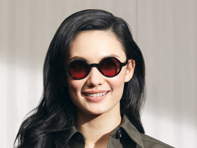 Model is wearing The ZOLMAN in Black in size 42 with Cabernet Tinted Lenses