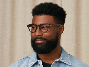 Model is wearing The MOMZA in size 49 in Tortoise