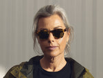 Model is wearing The MOMZA SUN in heritage/tortoise in size 46 with Calibar Green Glass Lenses