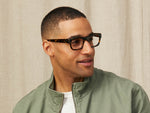 Model is wearing The NUDNIK in size 50 in Tortoise