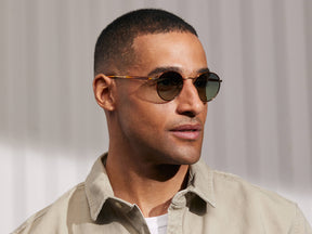 Model is wearing The PITSEL SUN in Blonde/Gold in size 47 with Forest Wood Tinted Lenses