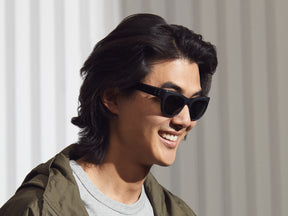 Model is wearing The PUSHKIN in Matte Black in size 51 with G-15 Glass Lenses