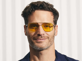 Model is wearing The SHTARKER in size 54 in Gold with Mellow Yellow Tinted Lenses