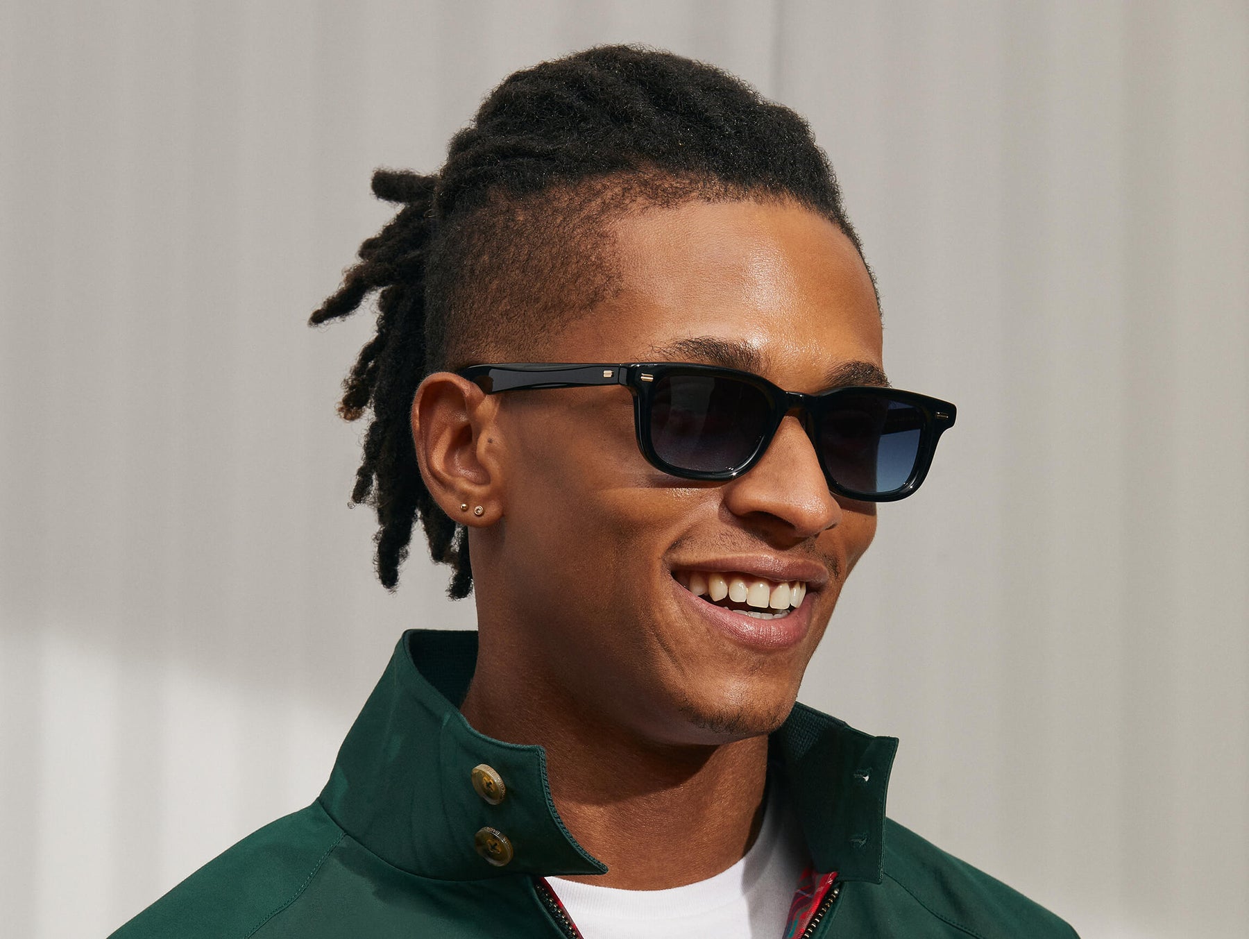 Model is wearing The KLUTZ SUN in Black in size 50 with Denim Blue Tinted Lenses