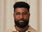 Model is wearing The TINIF in size 48 in Tortoise/Gold