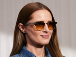 Model is wearing The TINIF SUN in Tortoise/Gold in size 48 with Chestnut Fade Tinted Lenses