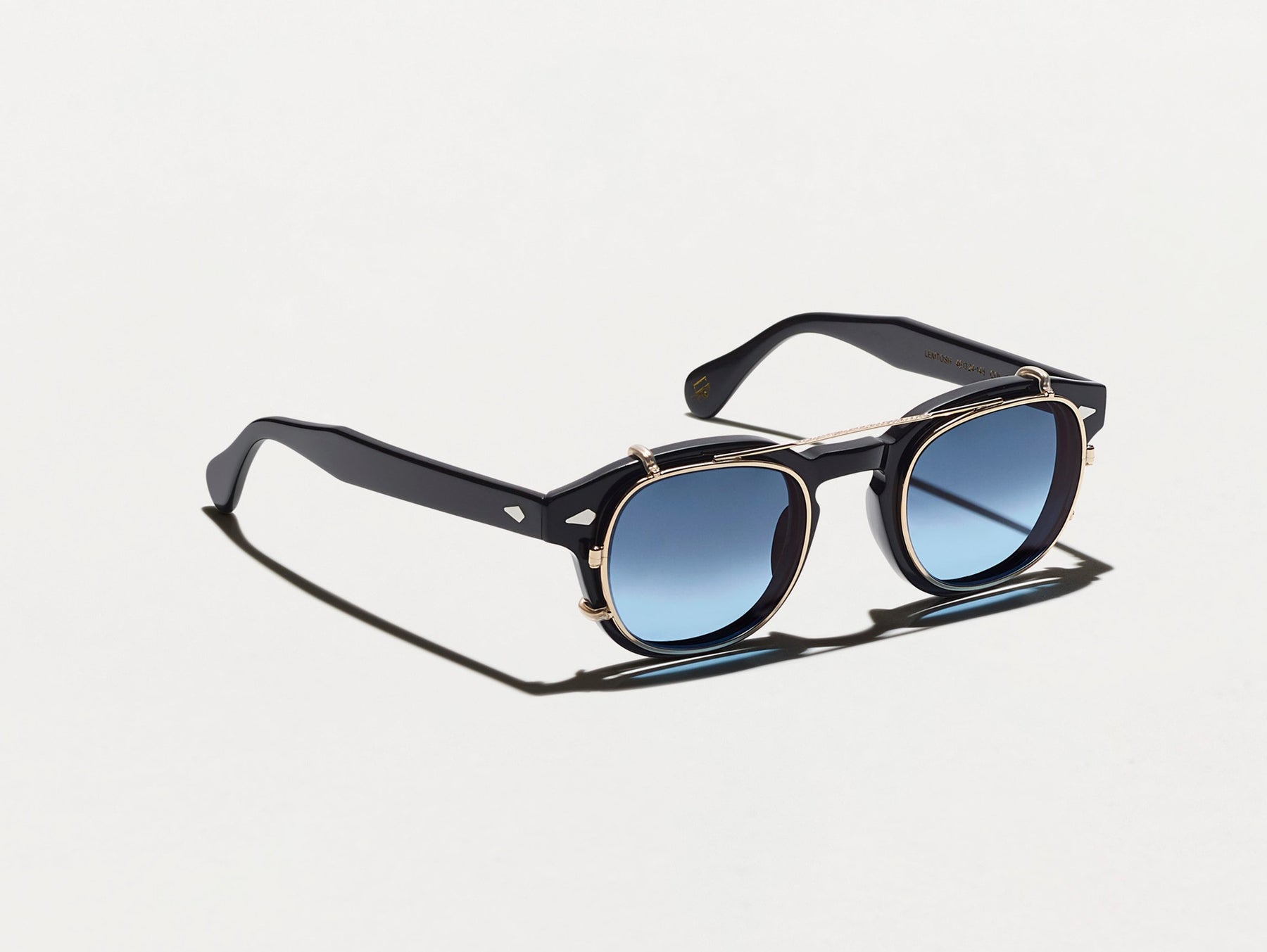The CLIPTOSH in Gold with Denim Blue Tinted Lenses