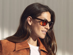 Model is wearing The CLIPTOSH in Gold in size 46 with Cabernet Tinted Lenses