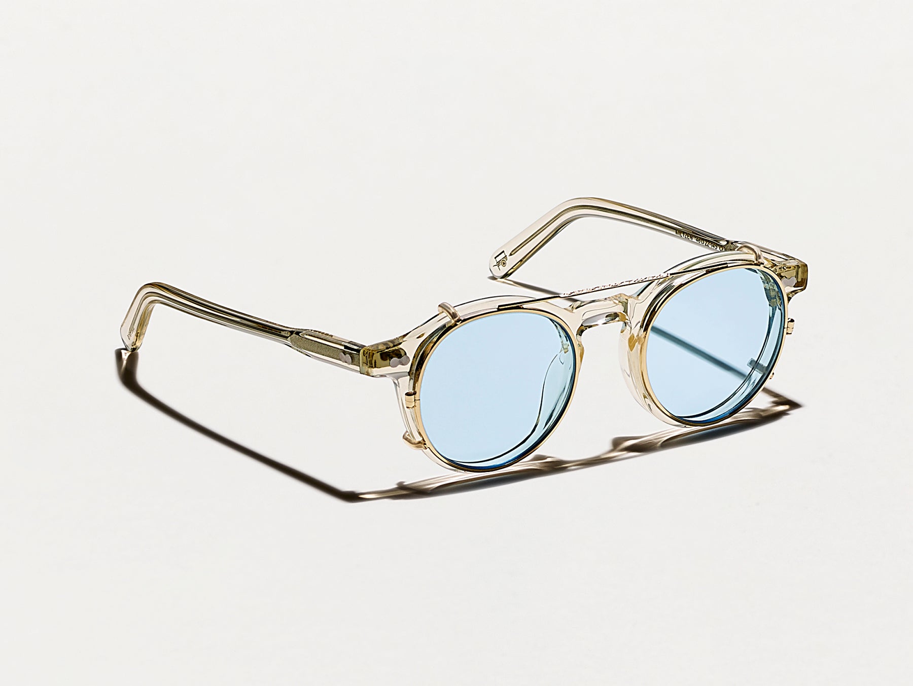 The CLIPZEN in Gold with Bel Air Blue Tinted Lenses