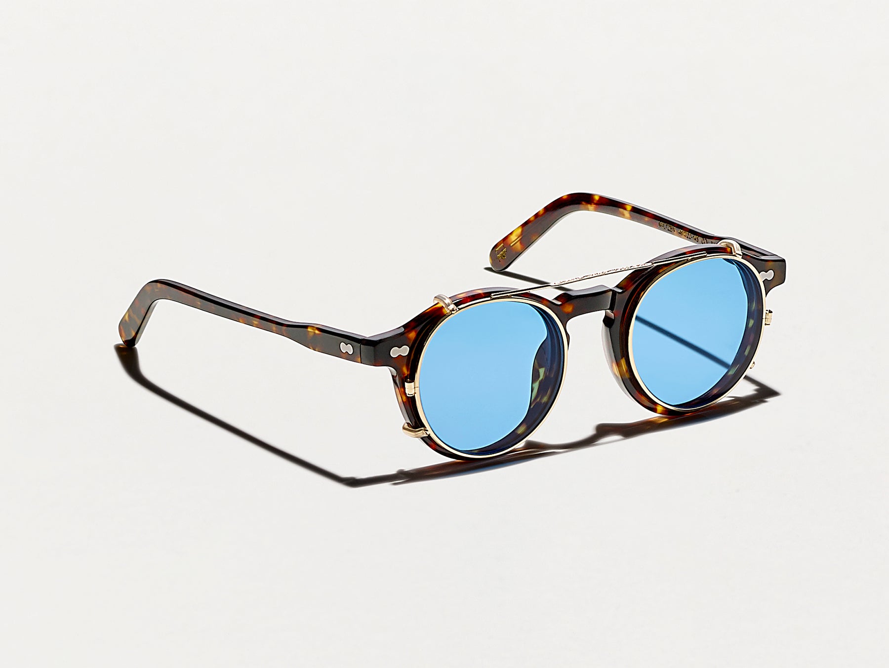 The CLIPZEN in Gold with Celebrity Blue Tinted Lenses