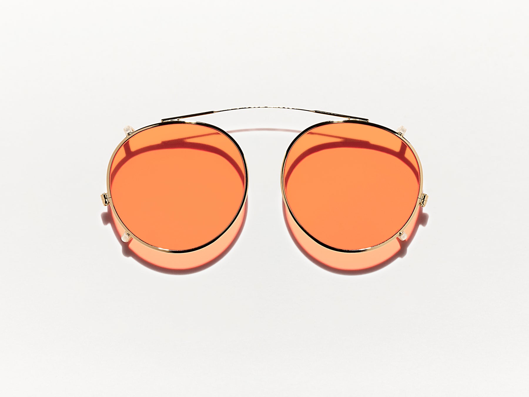 The CLIPZEN in Gold with Woodstock Orange Tinted Lenses