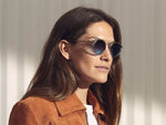 Model is wearing The CLIPZEN in Gold in size 46 with Denim Blue Tinted Lenses