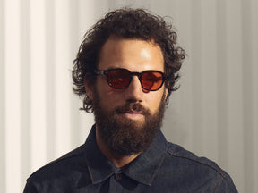 Model is wearing The LEMTOSH in Tortoise in size 46 with Woodstock Orange Tinted Lenses