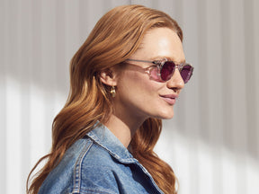 Model is wearing The CLIPTOSH in Gold in size 46 with Purple Nurple Tinted Lenses