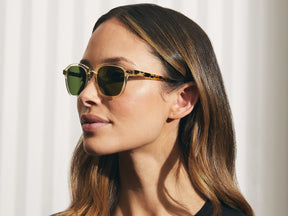 Model is wearing The VANTZ SUN in Citron/Tortoise in size 50 with Calibar Green Glass Lenses