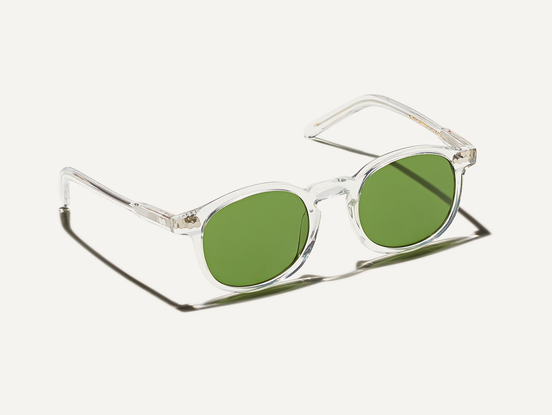 The VELVYL SUN in Crystal with Calibar Green Glass Lenses