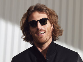Model is wearing The VELVYL SUN in Black size 46 with G-15 Glass Lenses