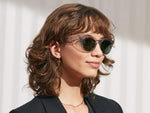 Model is wearing The VILDA SUN in Light Grey in size 48 with G-15 Glass Lenses