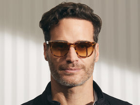 Model is wearing The YONTIF SUN in Tortoise/Crystal in size 49 with Chestnut Fade Tinted Lenses
