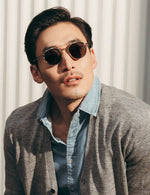 Model is wearing The ZEV CLIP in Gold in size 49 with G-15 Lenses