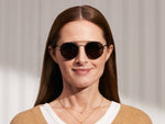 Model is wearing The ZEV CLIP in Matte Black in size 49 with G-15 Glass Lenses