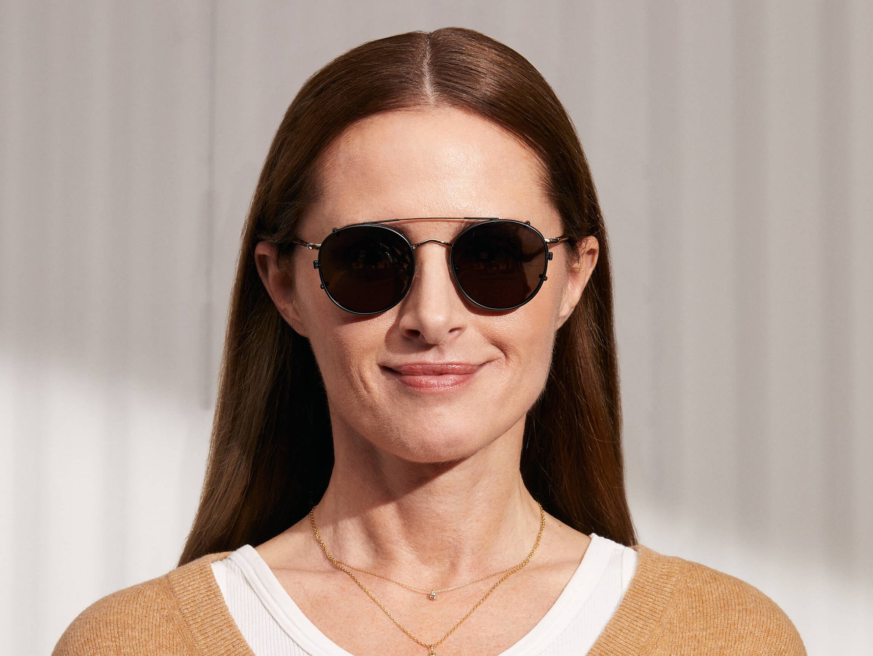 Model is wearing The ZEV CLIP in Matte Black in size 49 with G-15 Glass Lenses
